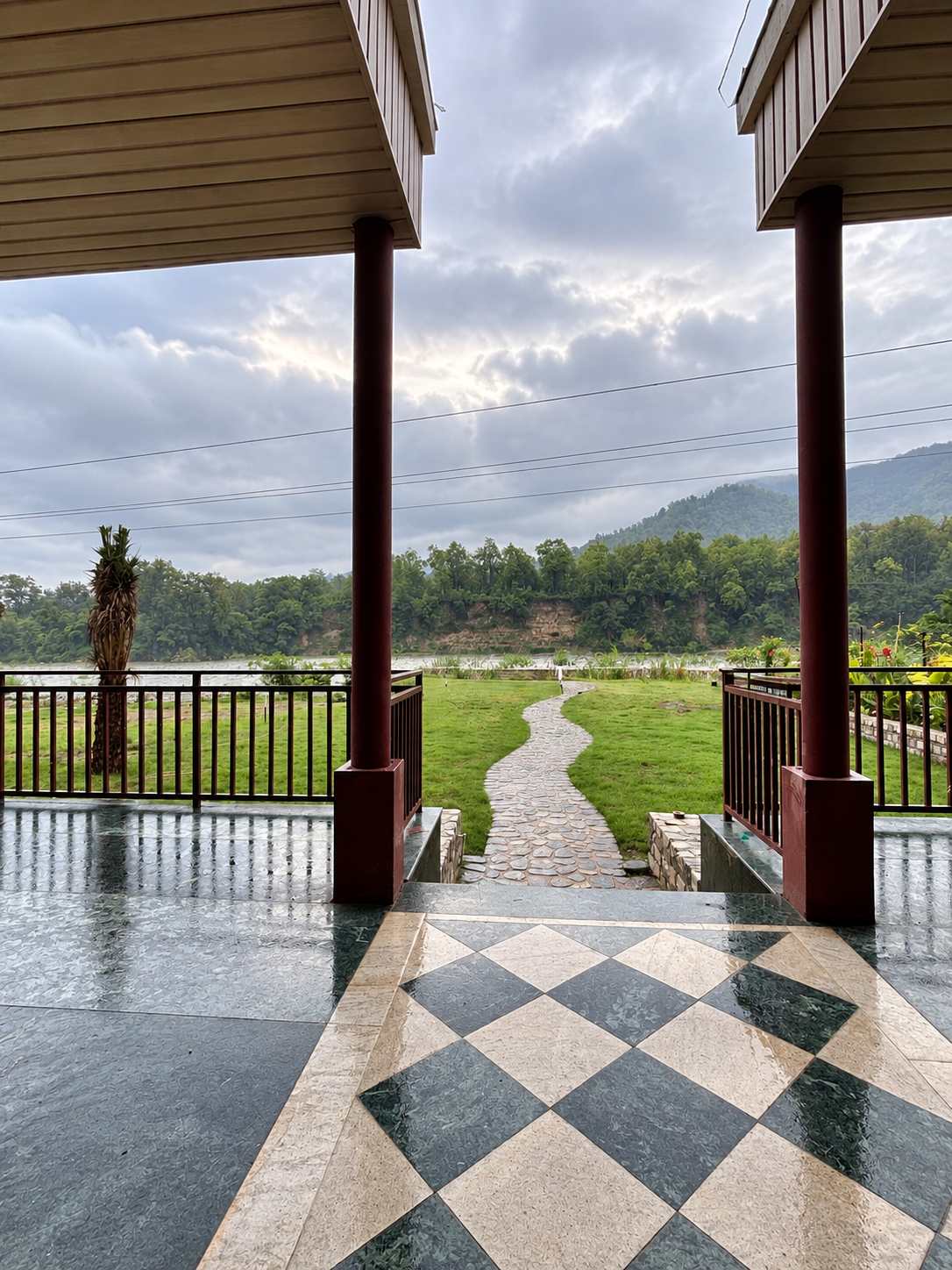 Heaven River Retreat mountain resort exterior at Ramnagar — forested Himalayan hills surrounding the property in Uttarakhand